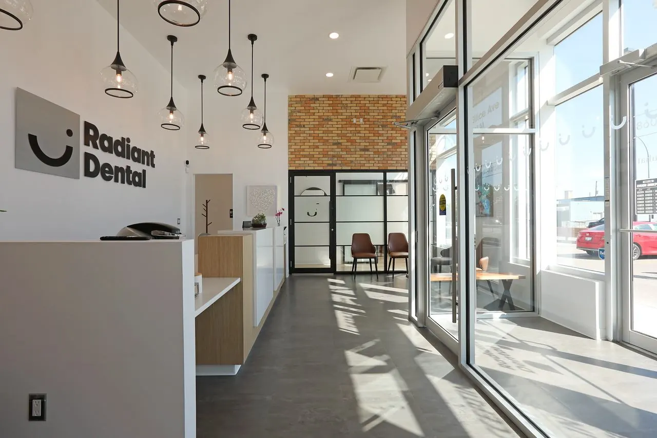 Radiant Dental front desk with pendant lights and floor-to-ceiling windows